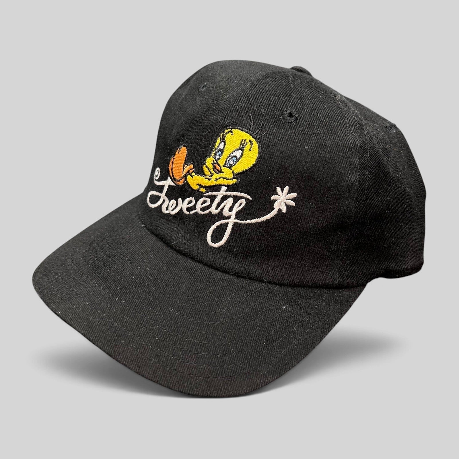 Raree Finds vintage 1998 Warner Bros Studio Store black cotton strapback hat with embroidered Tweety Bird logo