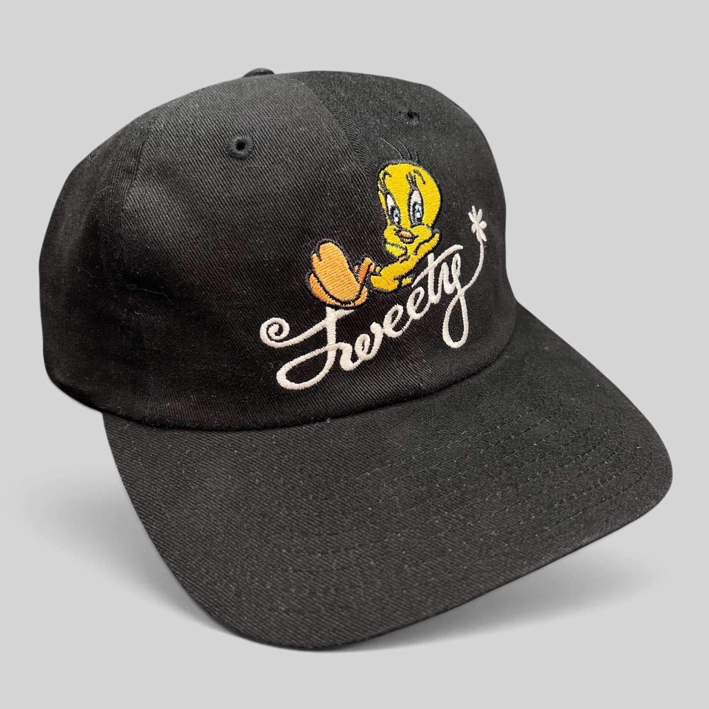 Raree Finds vintage 1998 Warner Bros Studio Store black cotton strapback hat with embroidered Tweety Bird logo