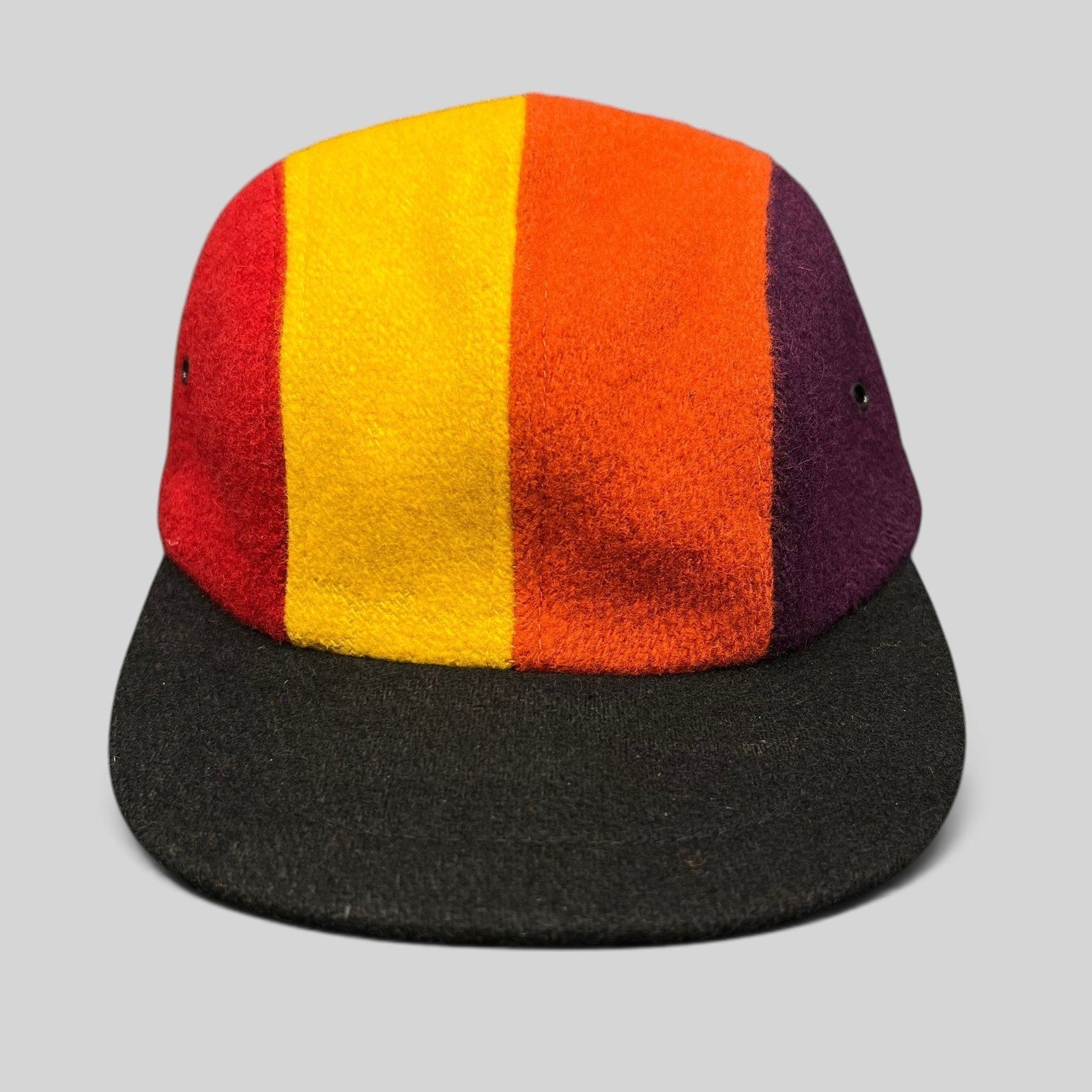 Raree Finds vintage 1980s New York Hat Co wool fitted cap featuring a multi-color block design and black brim.