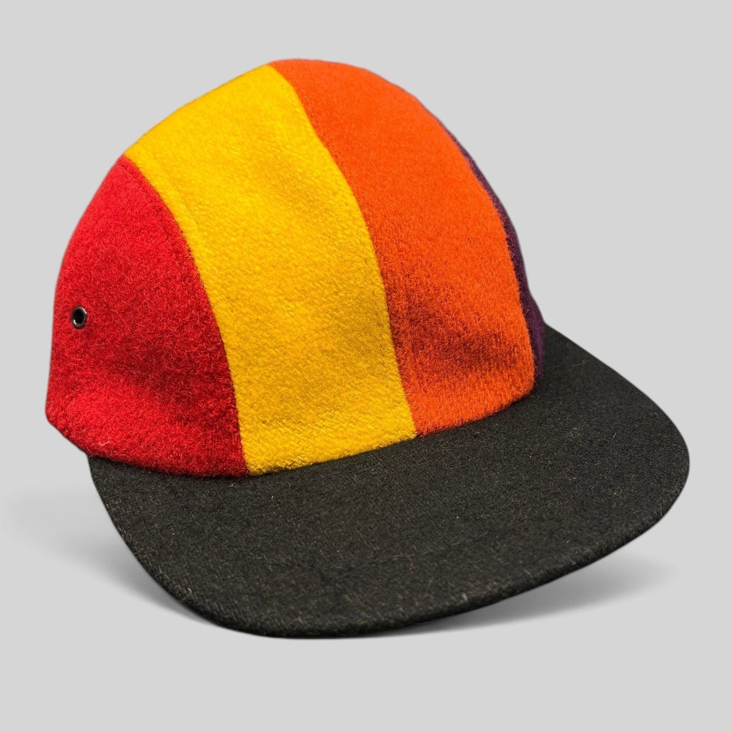Raree Finds vintage 1980s New York Hat Co wool fitted cap featuring a multi-color block design and black brim.