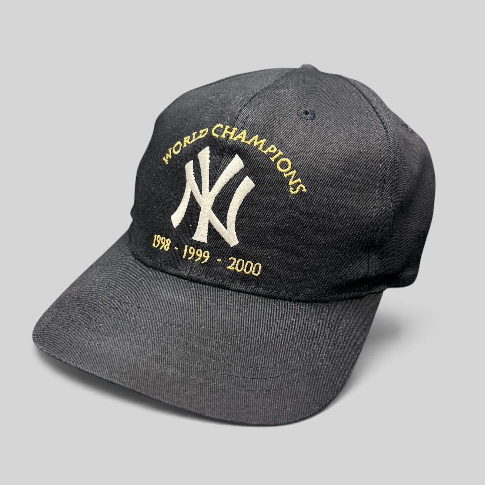 Raree Finds vintage black New York Yankees snapback with white and gold 1998-2000 World Champions embroidery