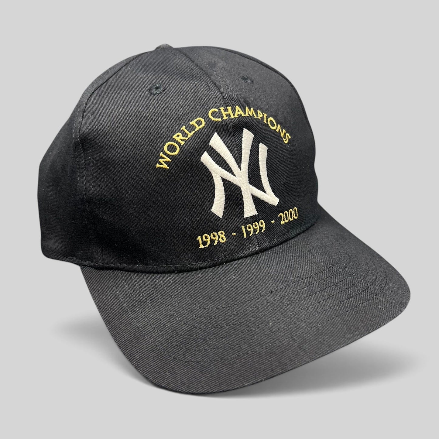 Raree Finds vintage black New York Yankees 3-peat World Champions snapback hat with white and gold embroidery