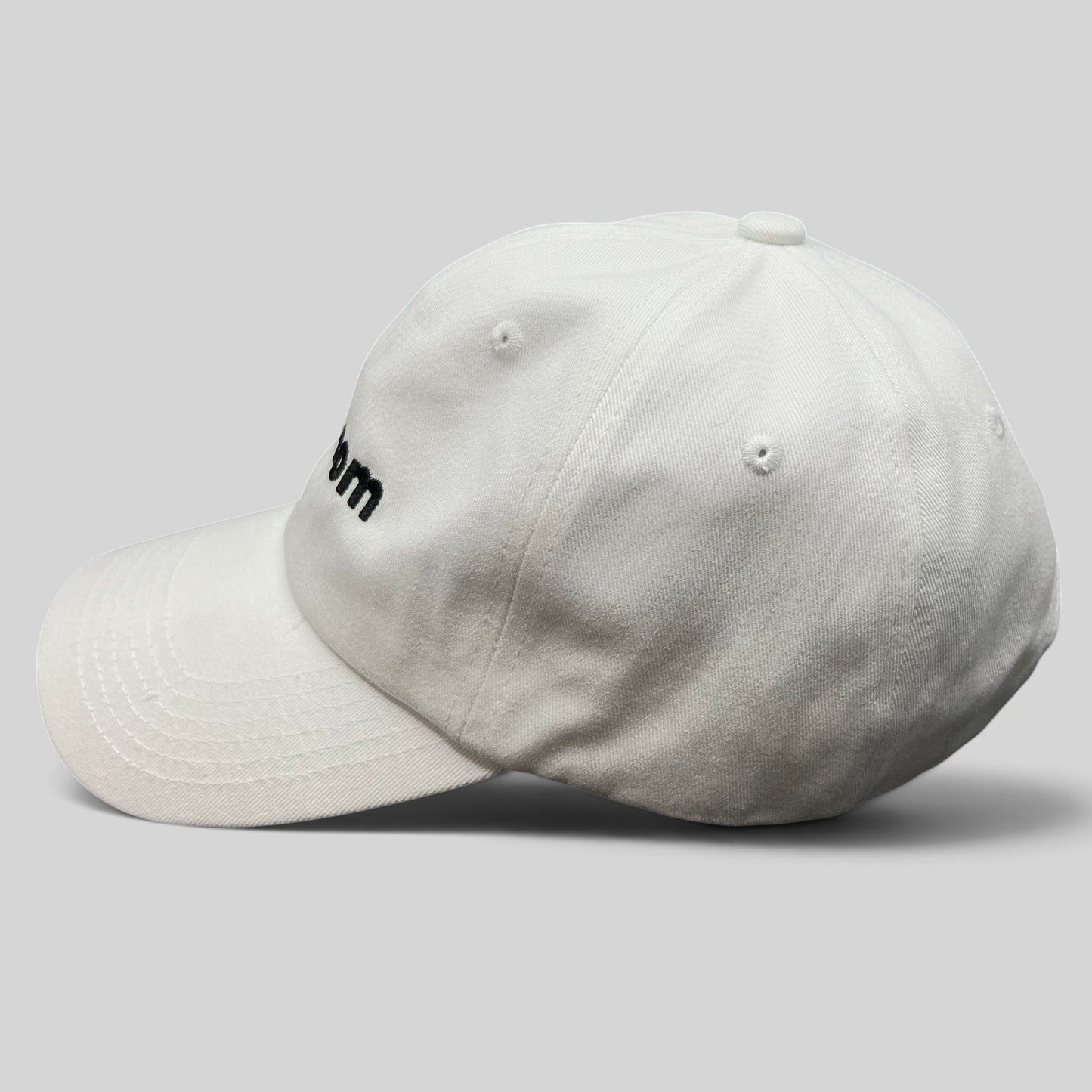 Raree Finds white cotton dad cap with black embroidered sex.com logo and side profile view