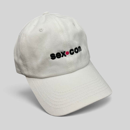 Raree Finds white cotton dad cap featuring an embroidered sex.com logo with a red dot accent and brass strapback