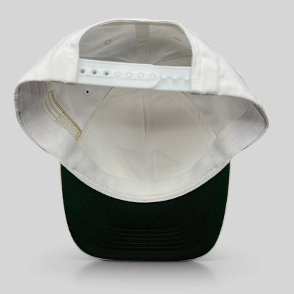 Raree Finds white cotton snapback hat with a green undervisor and adjustable plastic snap closure, back view.