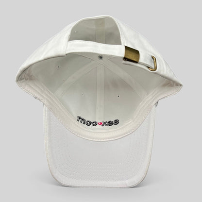 Raree Finds white cotton dad cap with adjustable strapback and brass buckle, showing interior logo embroidery