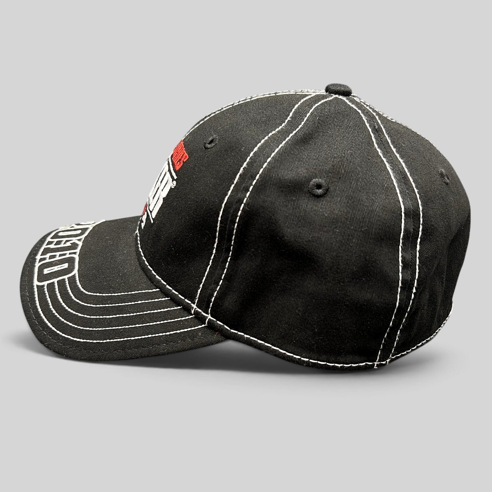 Raree Finds black 2010 World Series of Poker flexfit hat with white contrast stitching and embroidered brim detail.