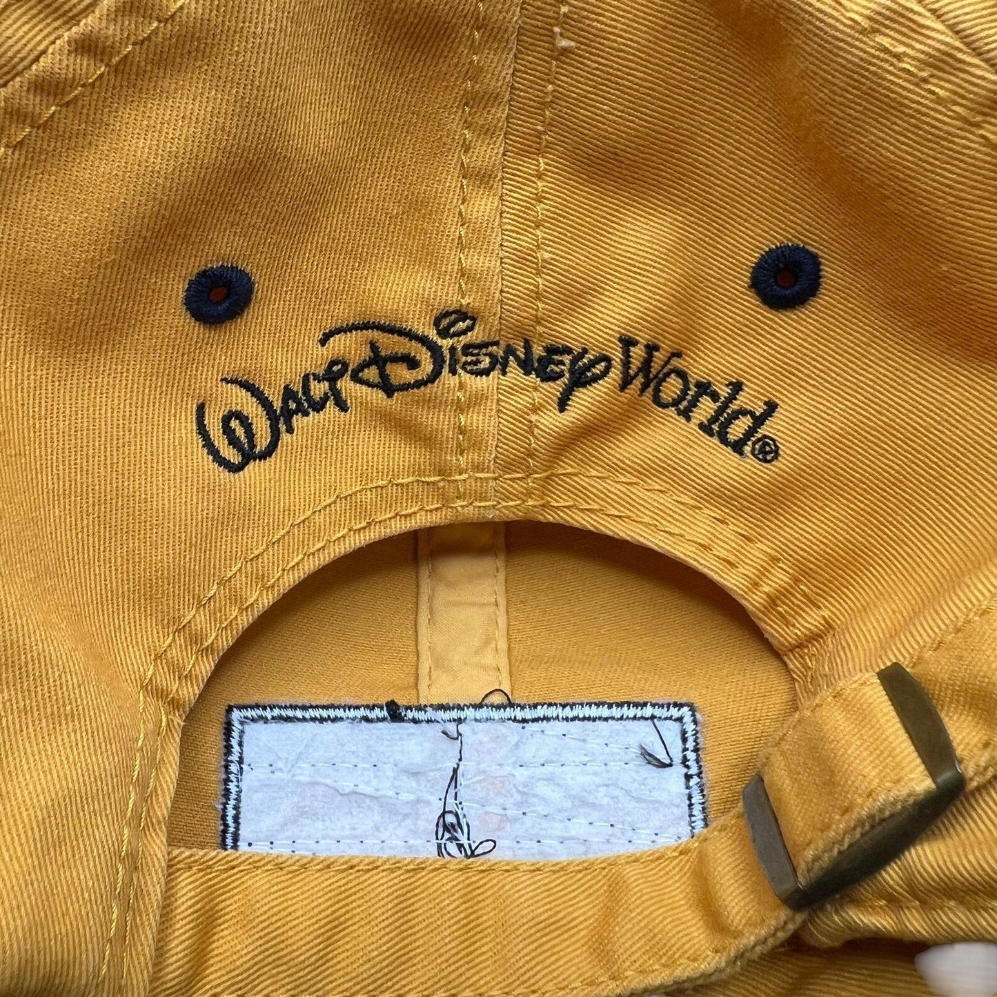 Raree Finds vintage yellow Walt Disney World cotton strapback hat with embroidered logo and metal buckle closure