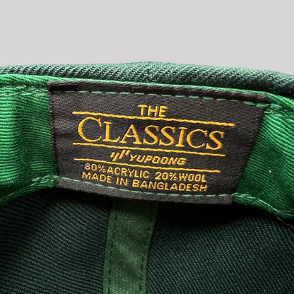 Raree Finds vintage Yupoong Classics snapback hat interior label showing material composition and origin