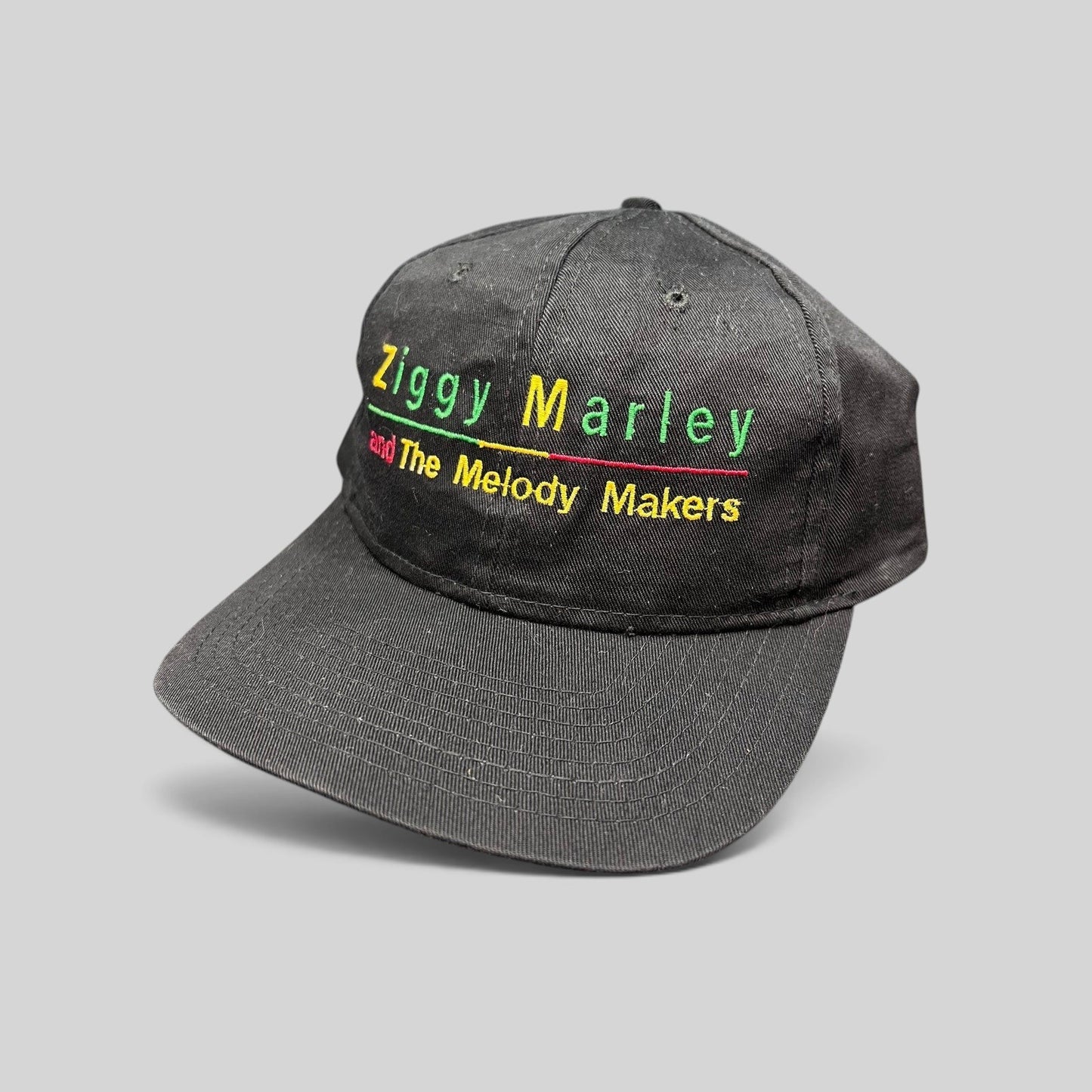 Raree Finds vintage 1995 Ziggy Marley and The Melody Makers black cotton snapback hat with Rasta-colored embroidery.